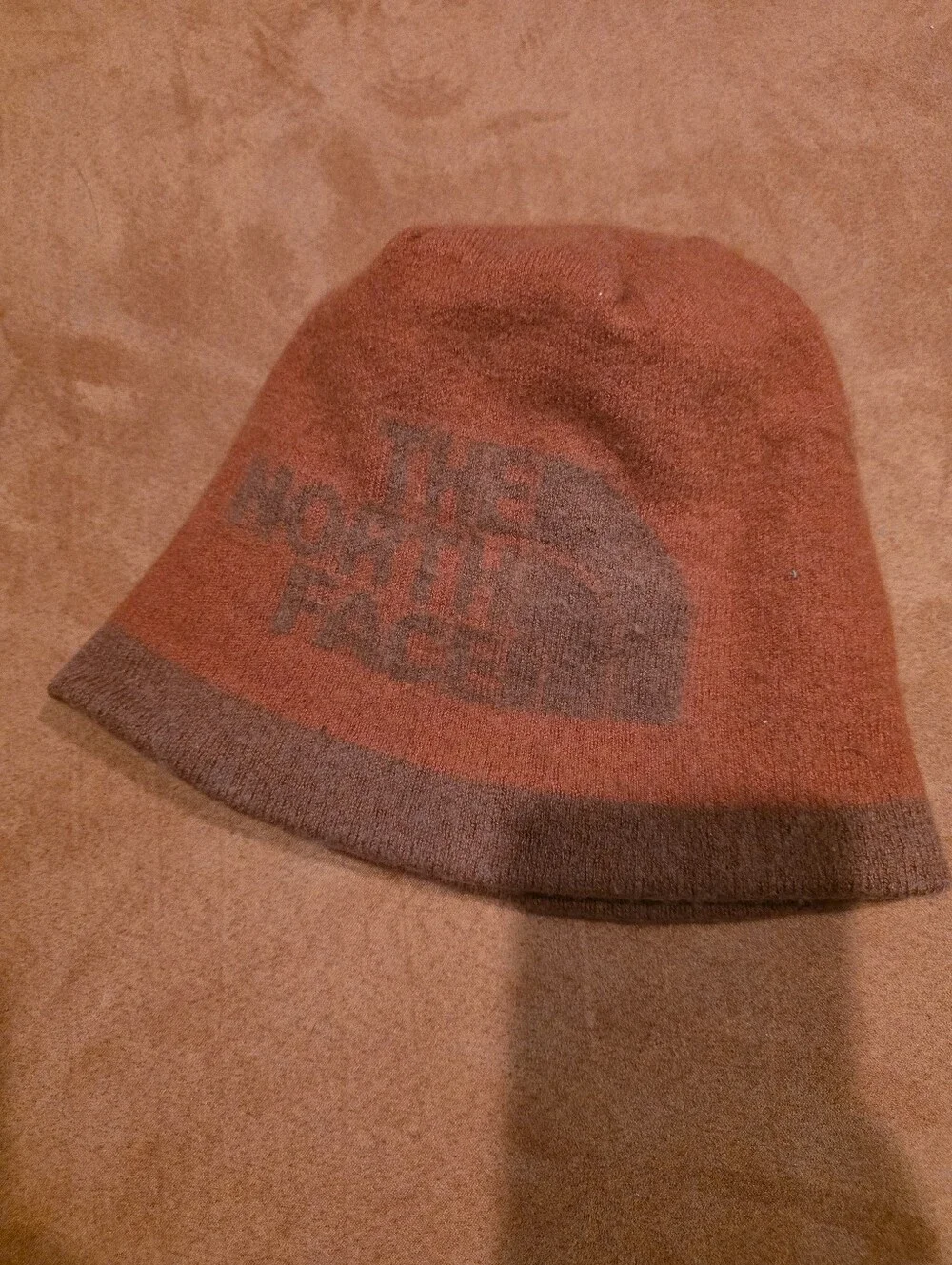 The North Face Rust Orange Knit Beanie with Subtle Logo